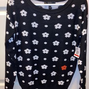Black sweater with white flowers